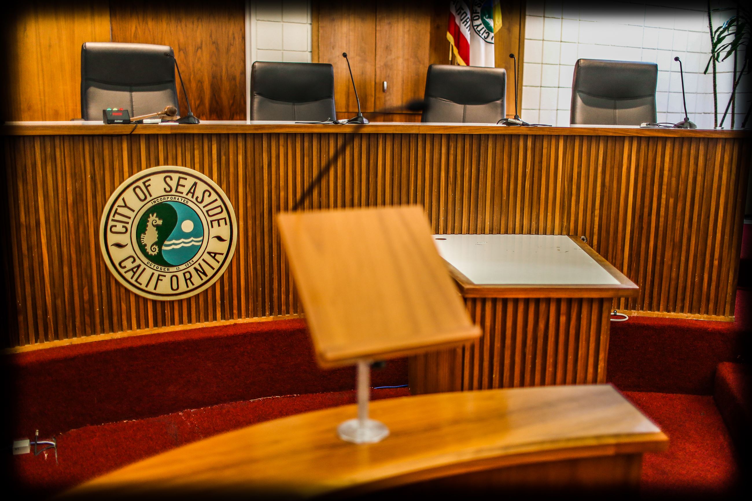 Public comment podium in front of dias